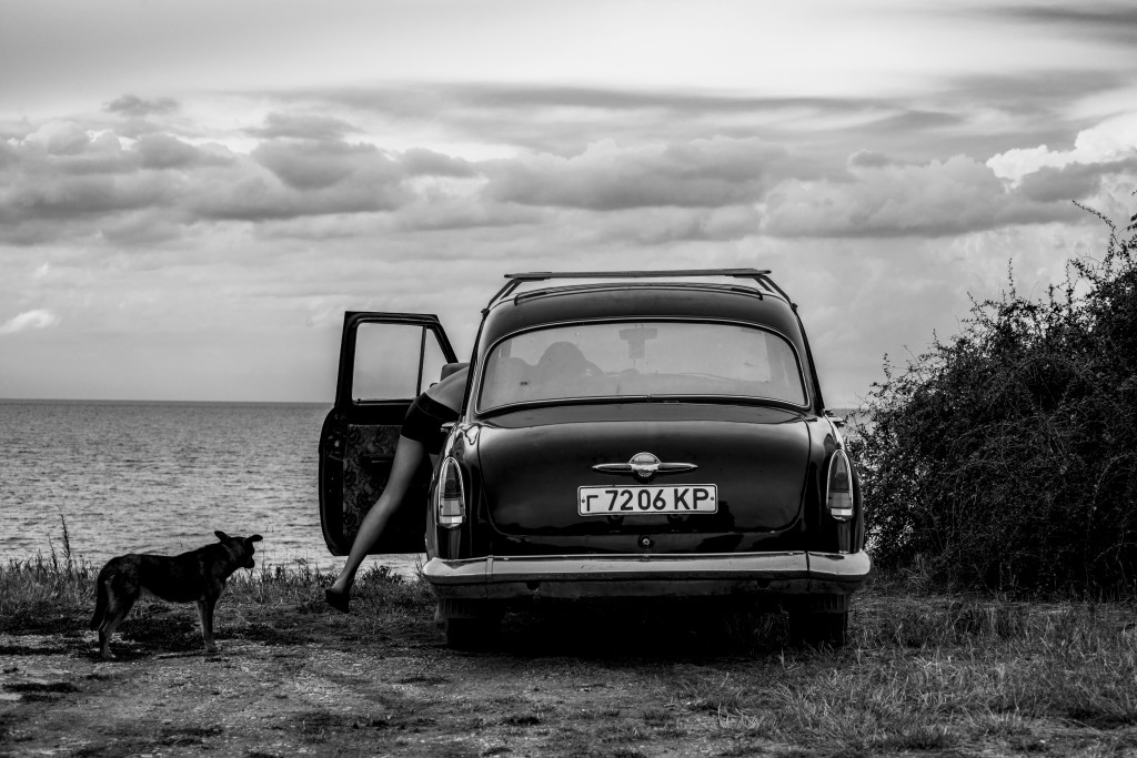 A car parked by the beach in Calamita Bay (35 km North of Sevastopol) where the British troops landed in September 1854, during the Crimean War. Crimea, 20 June 2014.