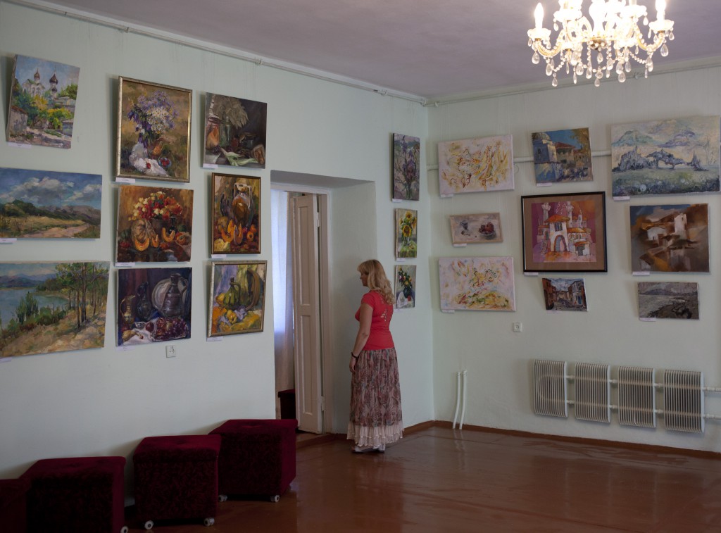A keeper in one of the rooms of Art Meseum in Khan Palace in Bakhchisaray. Crimea 03.08.14